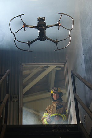 Fireman controlling a drone.